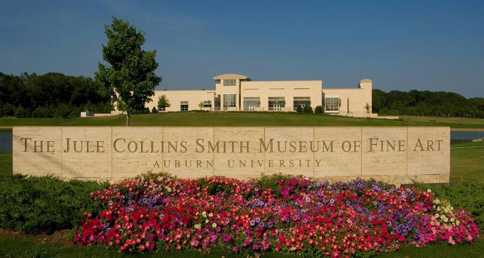The Jule Collins Smith Museum of Fine Art at Auburn University with colorful flowers.